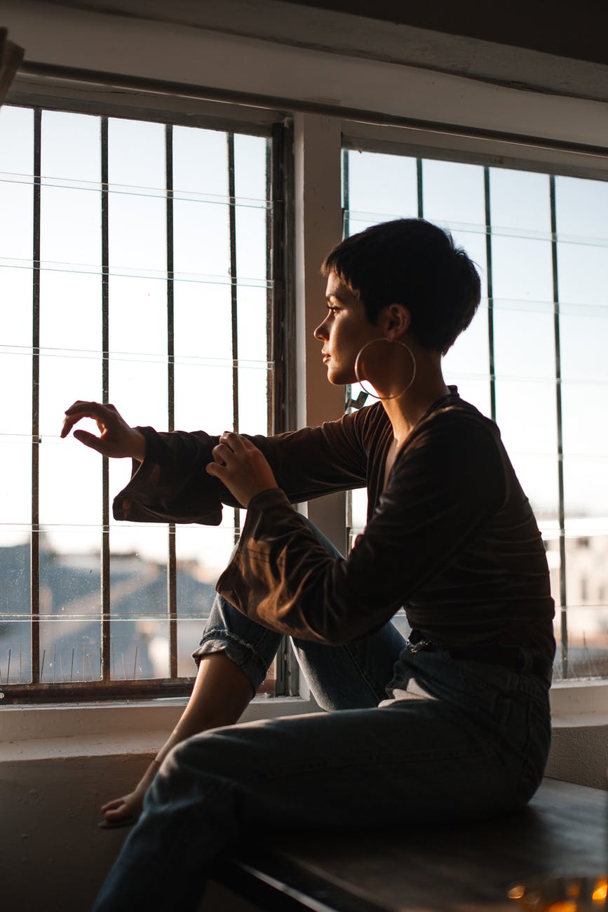 tranquil woman sitting in solitude near window 2 Chronicles 20:20